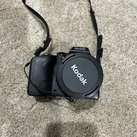 Black Kodak camera with accessories